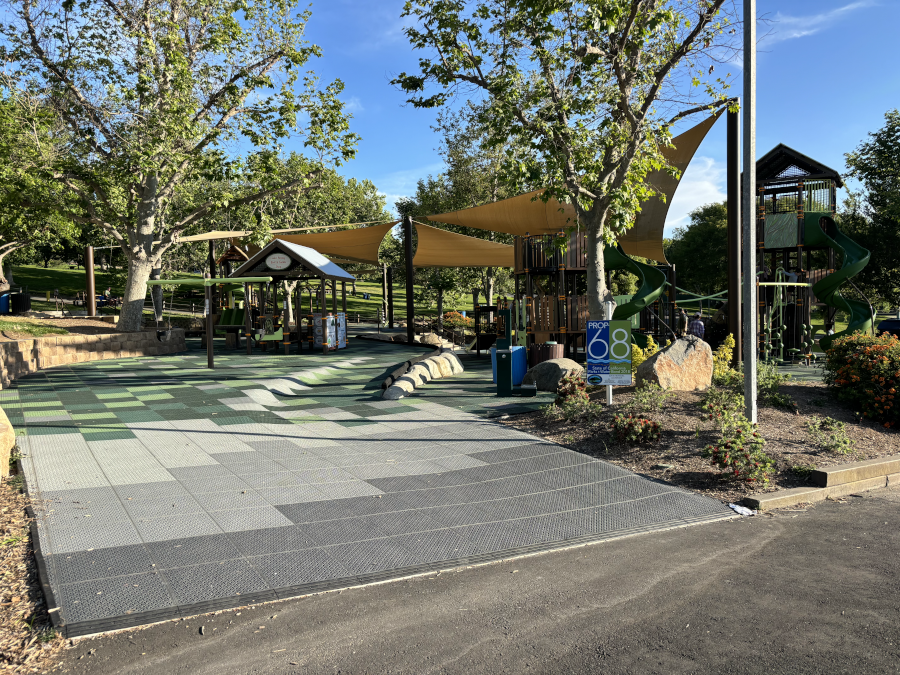 An accessible playground with trees.